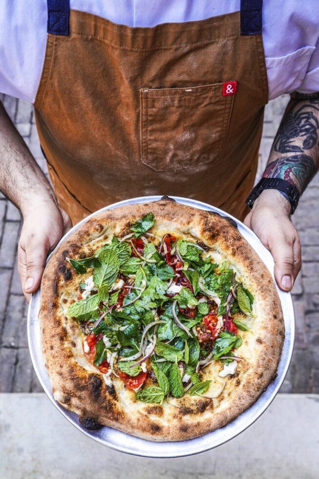 Restaurant Launches New Monthly Pizza Collab that Gives Back
